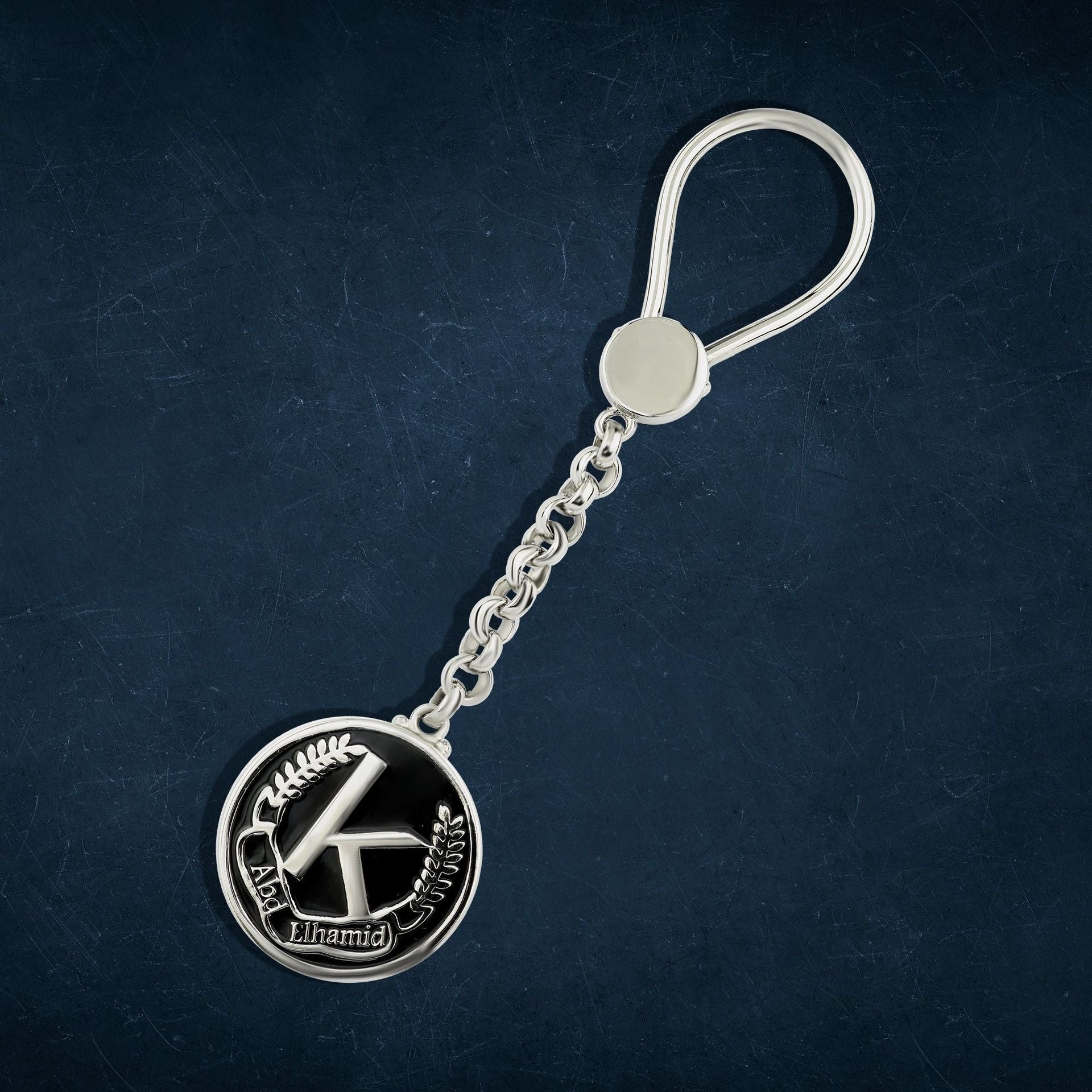 A luxurious 925 sterling silver keychain with your favorite design — an engraved design with an attractive decorative touch.