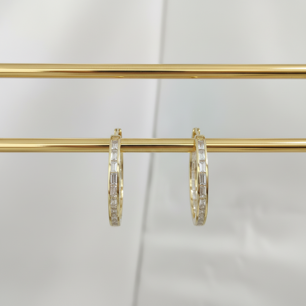 Circular clip-on earrings set with rectangular zircon stones, gold-plated over 925 silver.