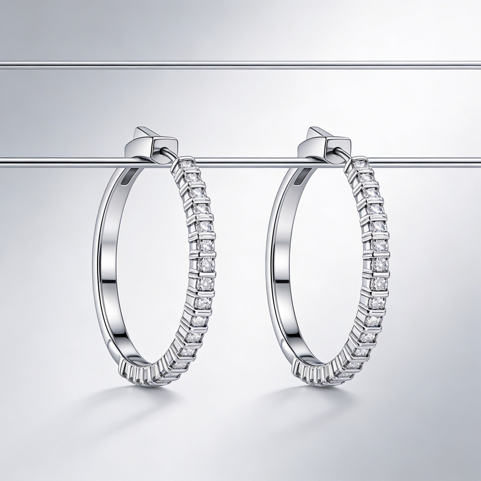 Clip-on hoop earrings adorned with sparkling zircon stones, 925 silver.
