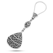 Silver teardrop-shaped keychain engraved with the words “For Allah is the Best Protector and He is the Most Merciful – Allahu Akbar – O Opener of Doors – Masha’Allah”