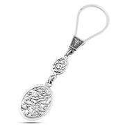 Silver keychain engraved with the words “Verily, in the remembrance of Allah do hearts find peace – O Opener of Doors – Masha’Allah”