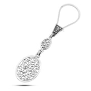 Silver keychain engraved with the phrases "For Allah is the best protector, and He is the most merciful of the merciful” and “Masha’Allah.”