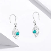 Silver hoop with an Arabic hollow design
