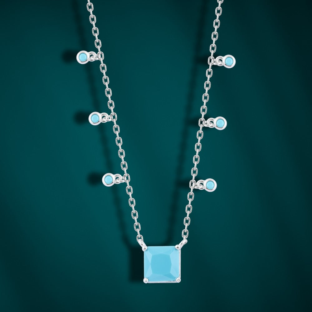 Blue Glow Necklace – 925 Sterling Silver with Dangling Details and a Radiant Centerpiece