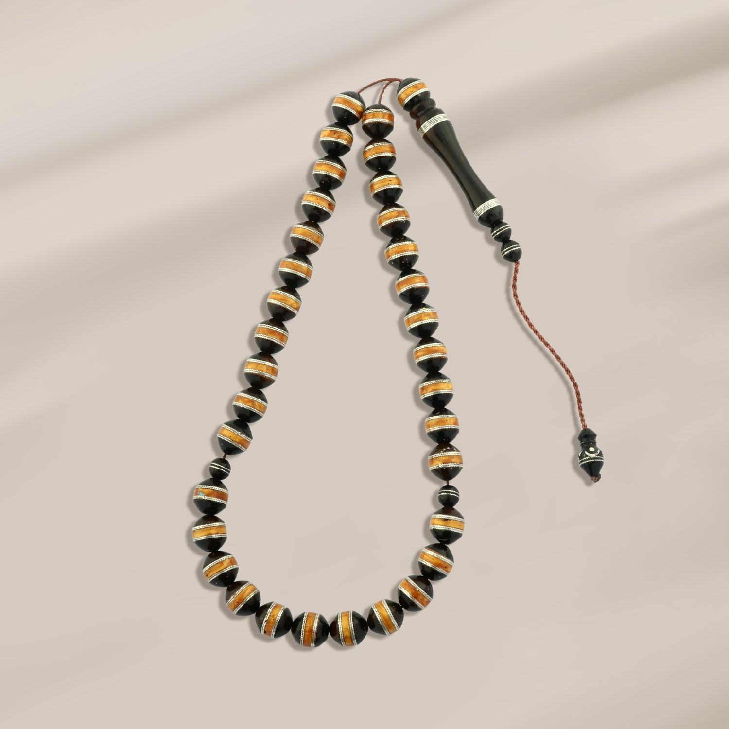 سبحة فضة عيار 999 بتصميم كهرماني أنيق للجنسين