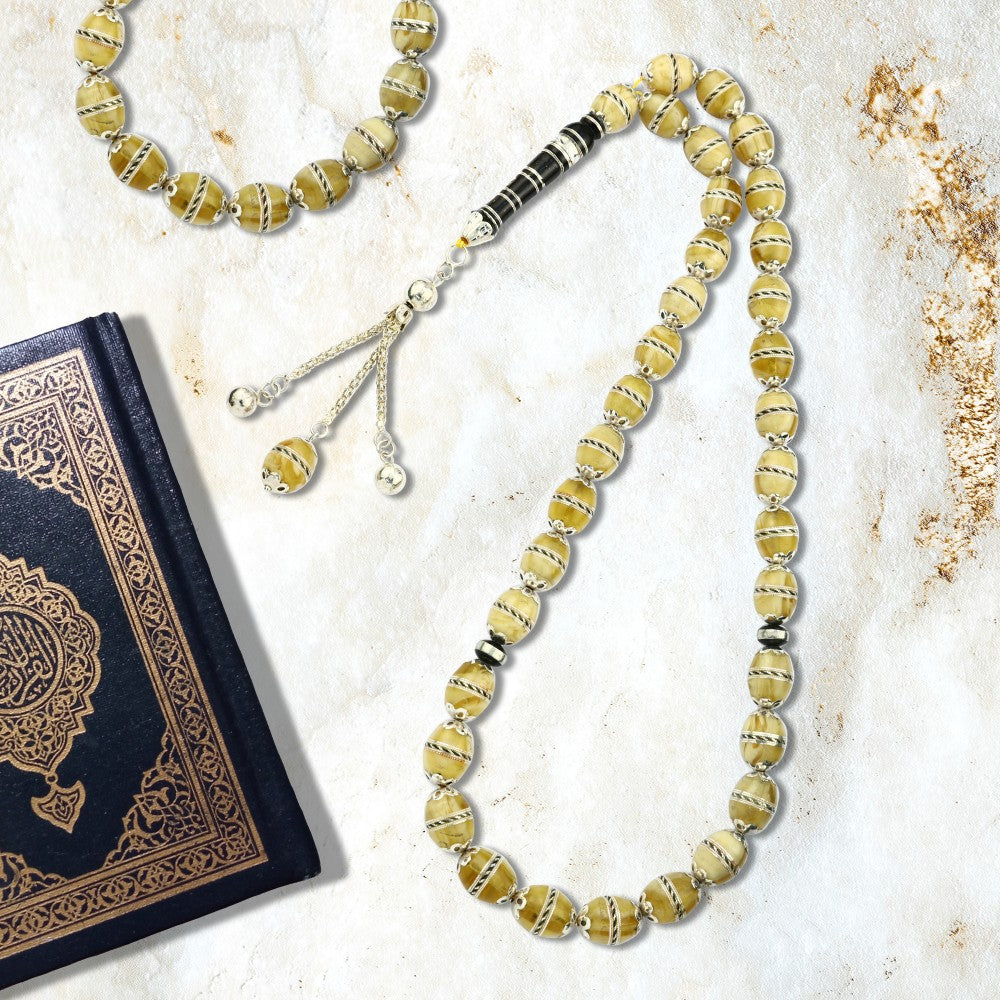 Natural yew rosary inlaid with amber and a silver tarboosh, 33 beads