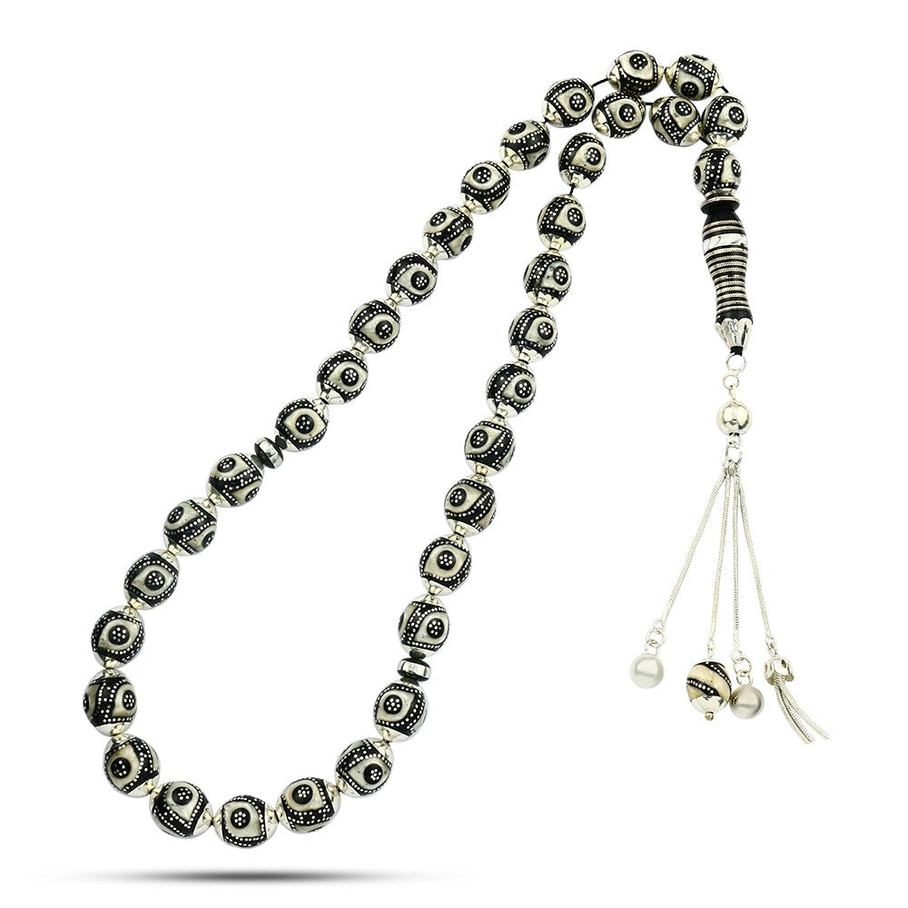 Prayer beads made of luxurious black coral, inlaid with silver, turquoise, and ivory, 33 beads.