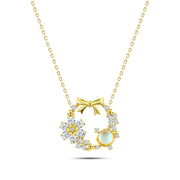 A floral circle necklace with a pearlescent stone and bow, crafted from 925 silver.