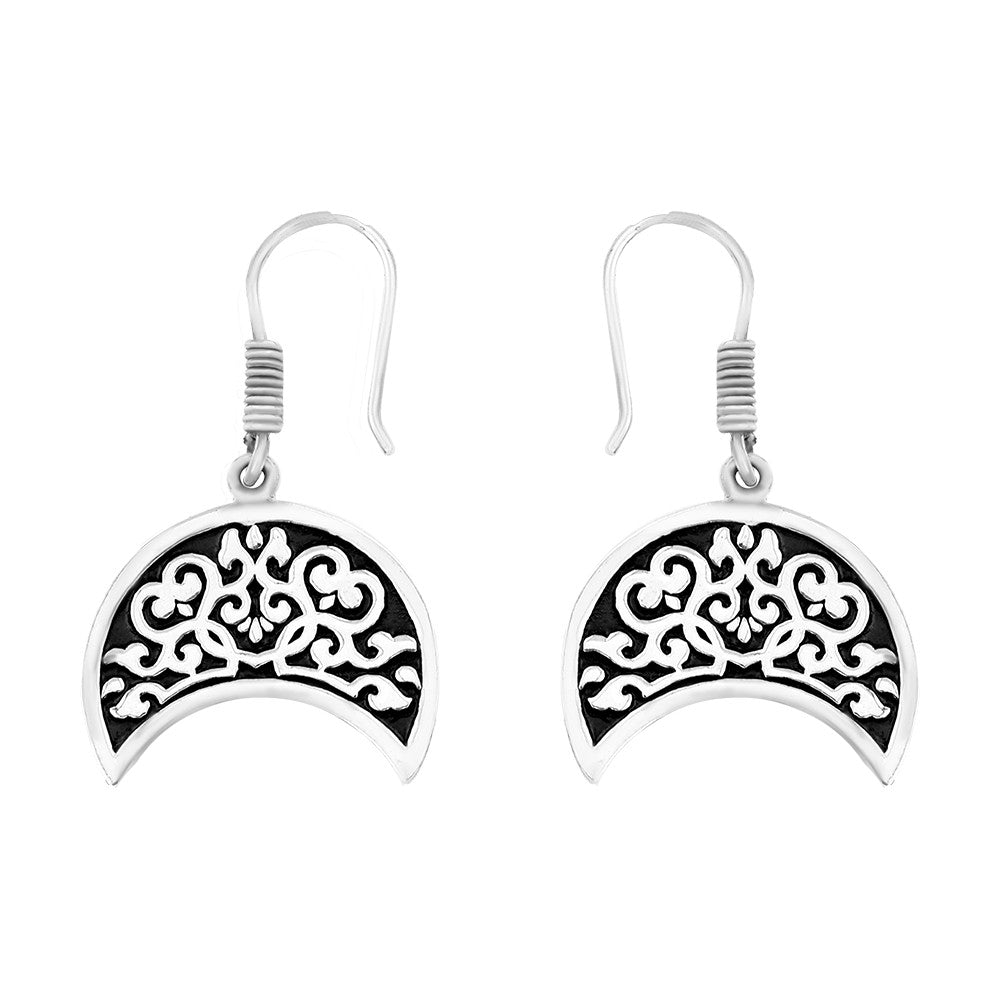 Silver earrings with an ornate Arabic design