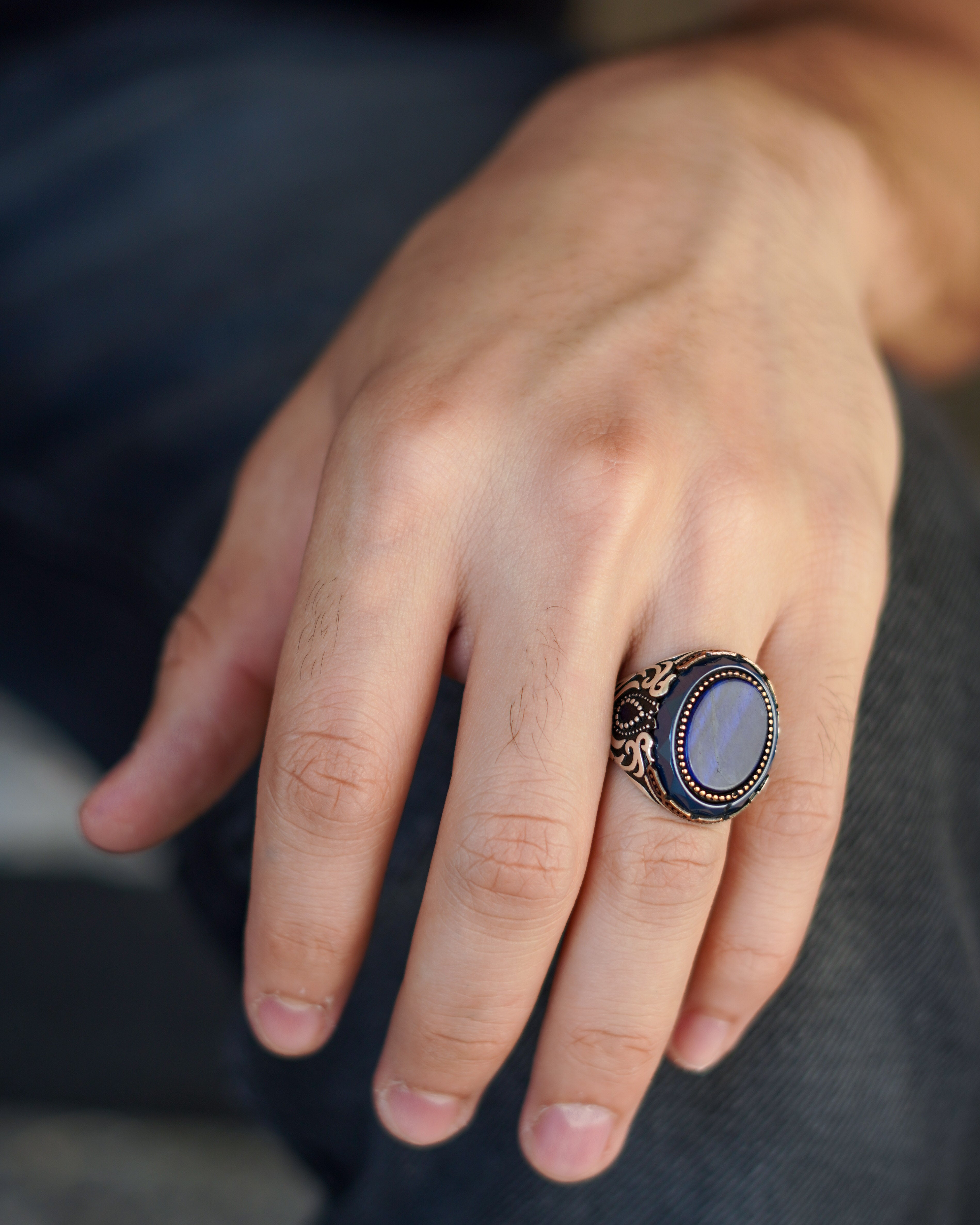 Men’s Silver Ring with Black Onyx, Gold Detailing, and Ornamental Side Engraving

