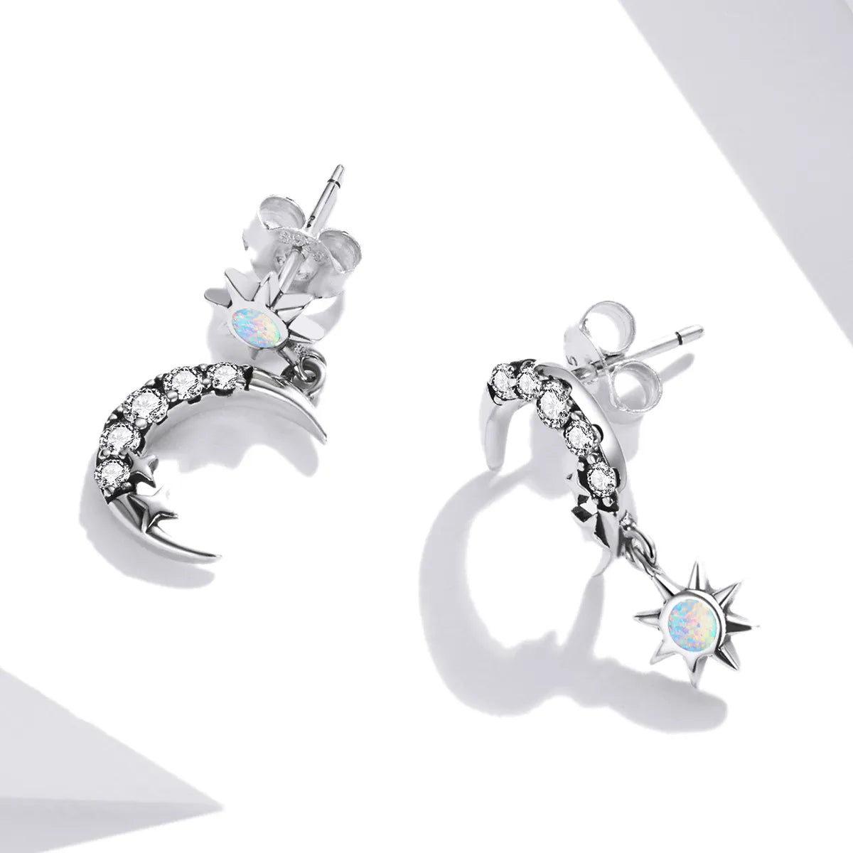 925 silver hoop earrings with a crescent moon design and dangling star