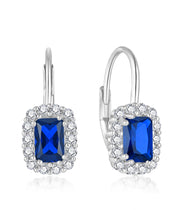 925 sterling silver earring with a blue zircon stone and a transparent frame