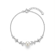 925 silver bracelet with a pearl and pavé-set floral accents.
