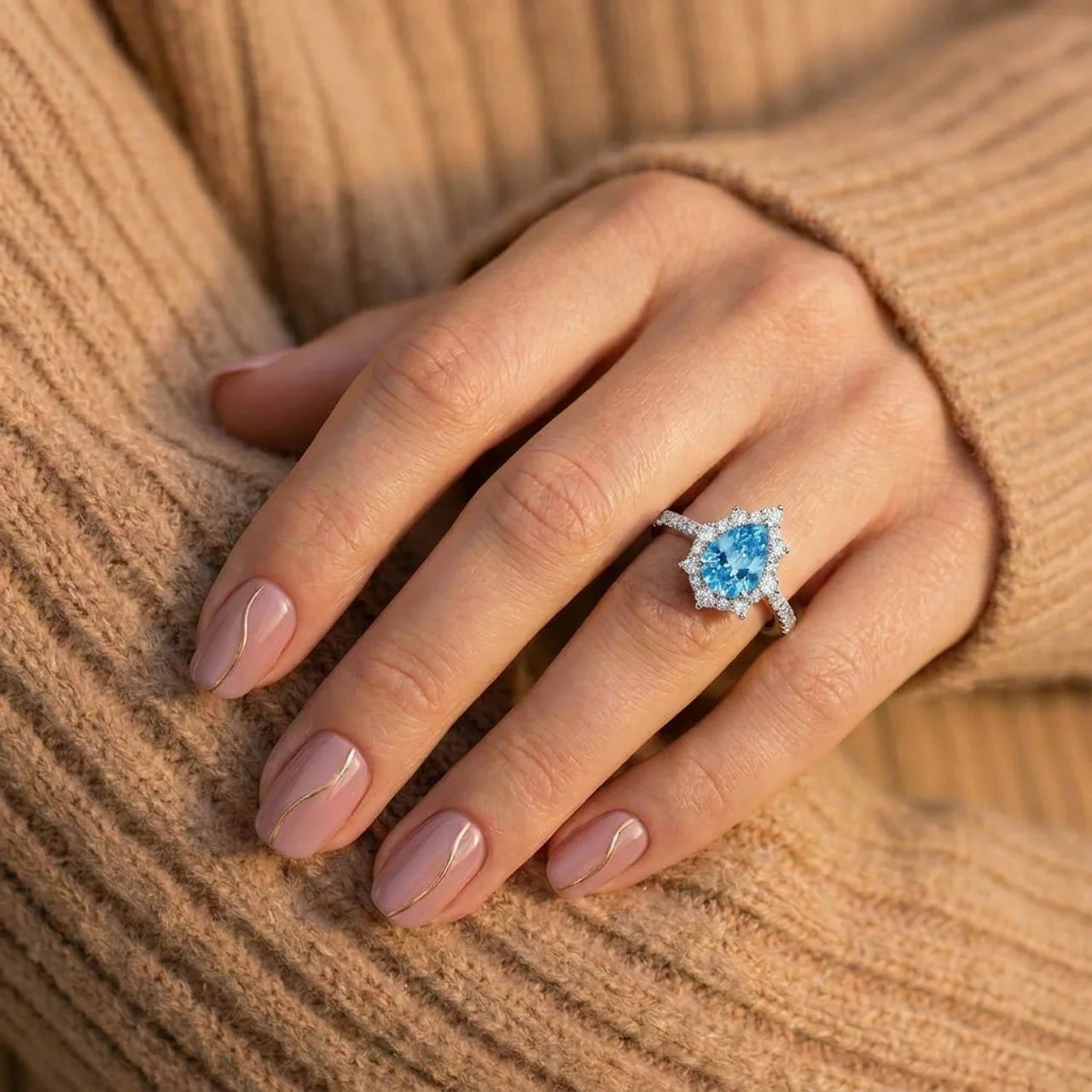 925 Silver Ring with a Light Blue Teardrop Stone and Delicate Details