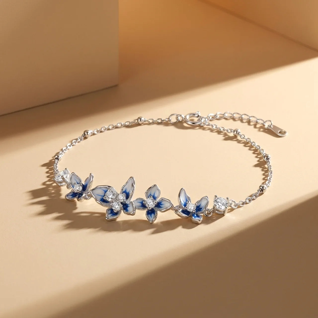 Elegant 925 Silver Bracelet with Blue Flowers and Sparkling Stones